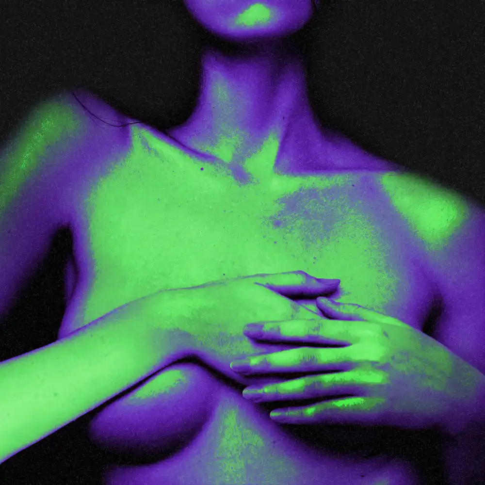 Artistic duo-color image of a female figure covering her breasts