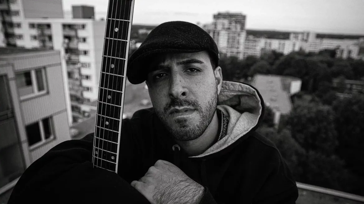 Black and white outdoor portrait of SERVAN, a German Hip-Hop artist, expressing his fearless artistry in the song "21st Century."