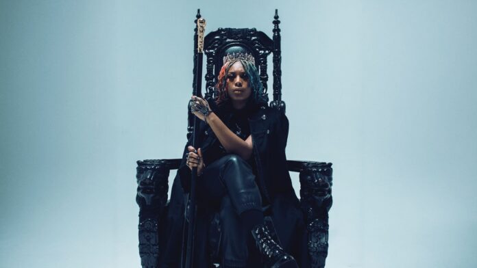 Artist Forever The Rebel seated on a gothic throne holding a scepter.