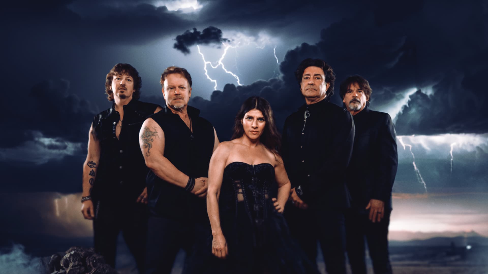 Band SD17 stands strong against a stormy backdrop symbolizing their defiant spirit in metal music.
