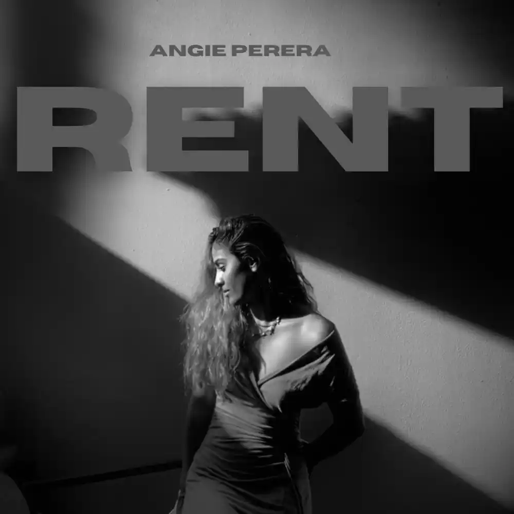 Angie Perera stands poised in 'Rent' cover art, a silhouette of empowerment cast in shadows and light.
